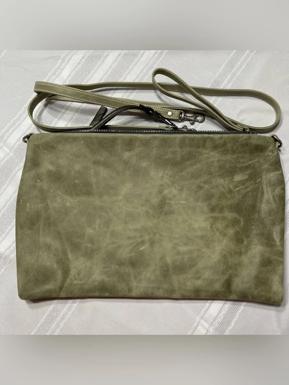 Rough & Tumble Covet in light green leather.